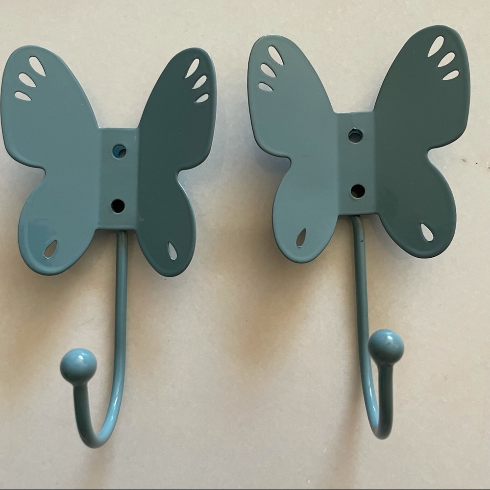 Two butterfly shaped wall hooks